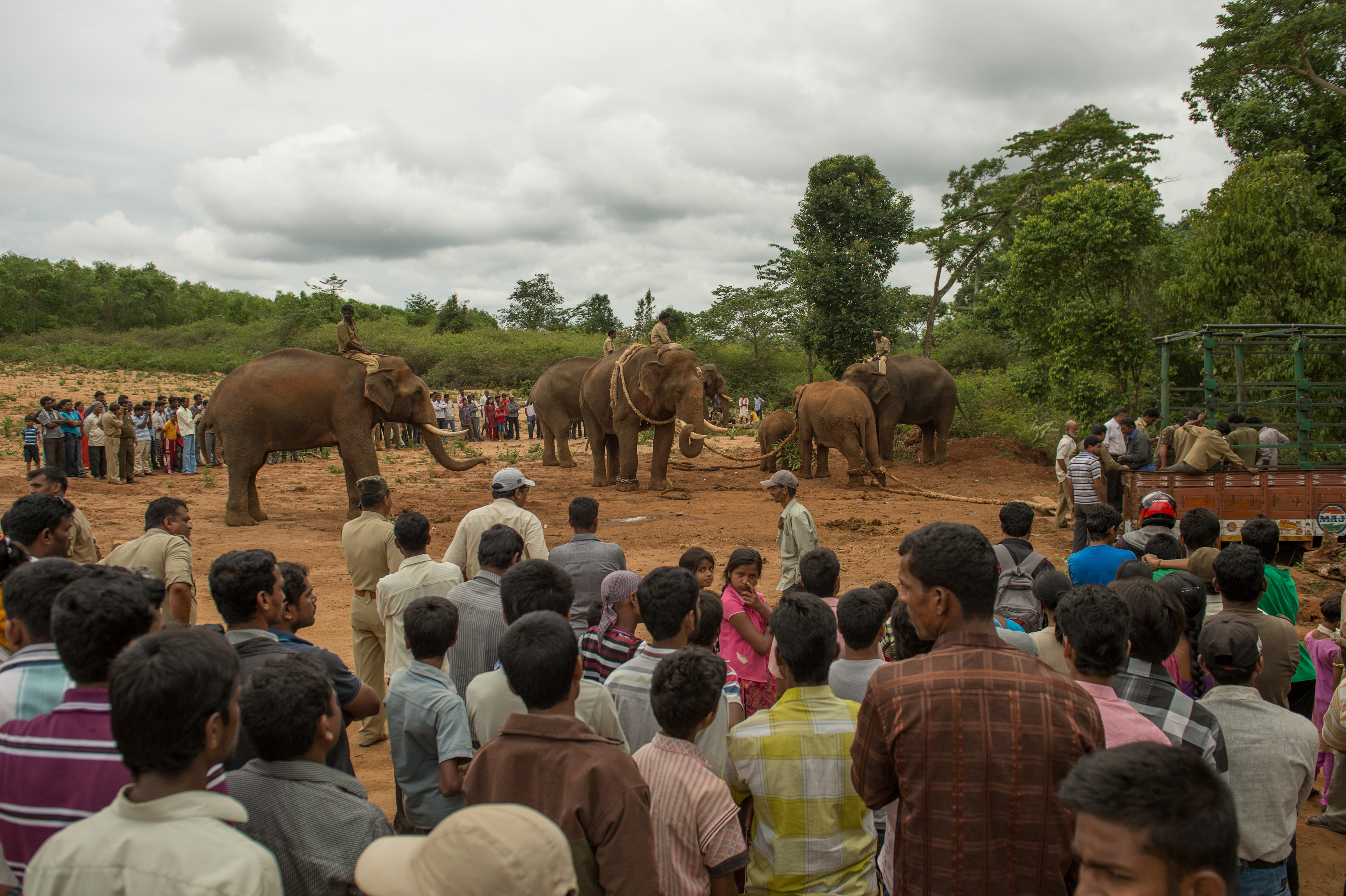 Farmers confronting officials at the village council meeting