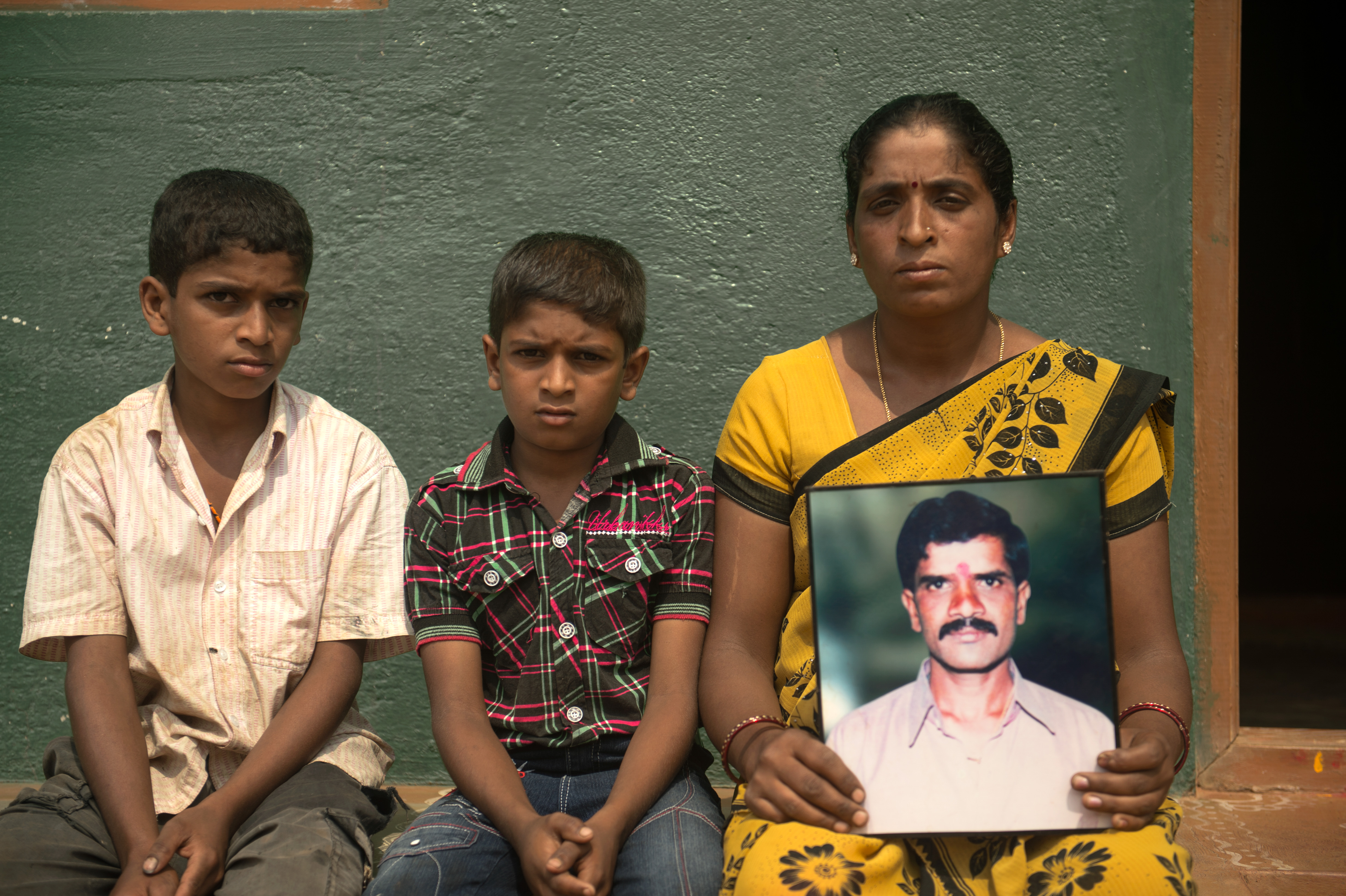 Ambuja farming her two-acre plot in Majegepura