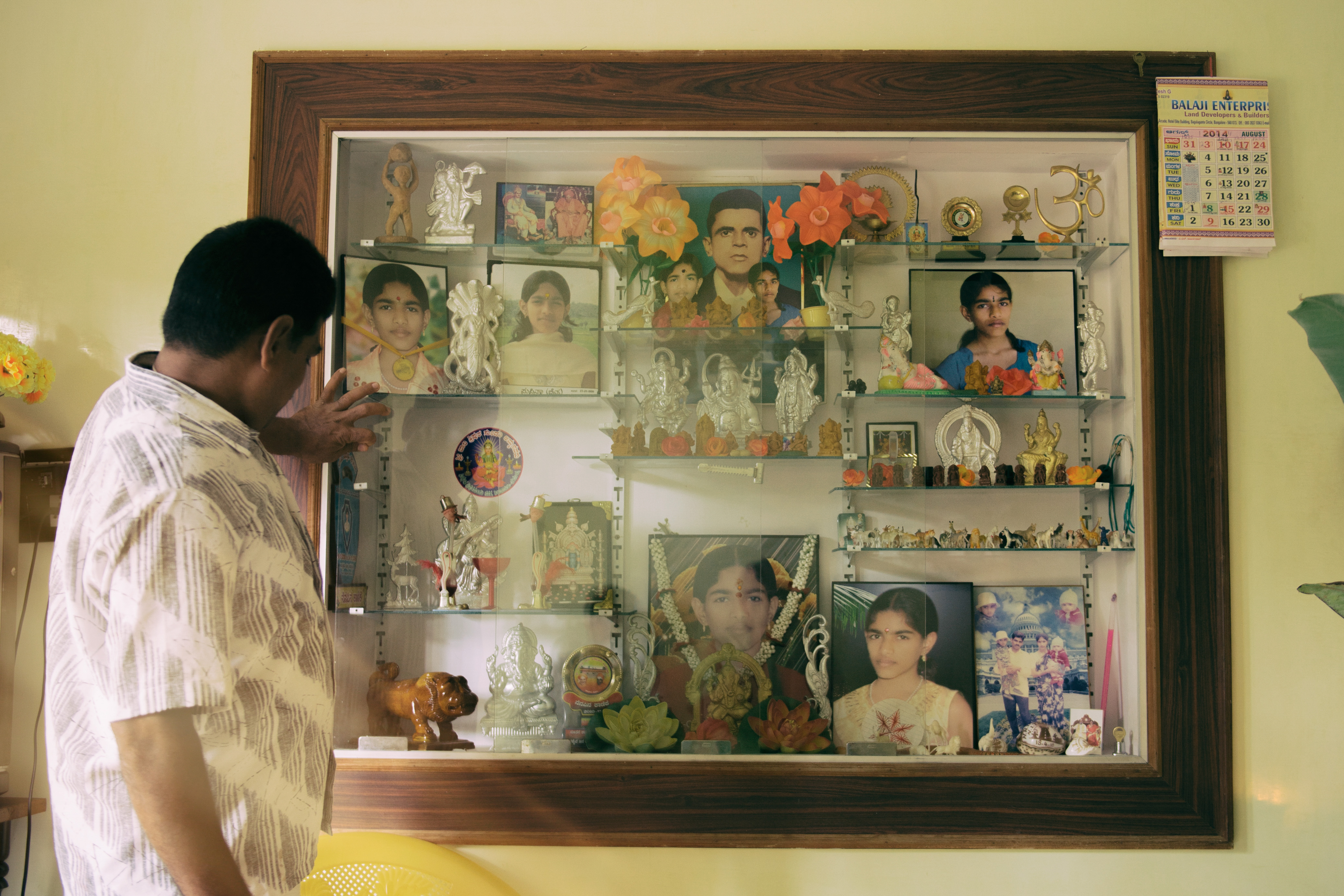 Ganesha idols and Suprita's photographs in the family home